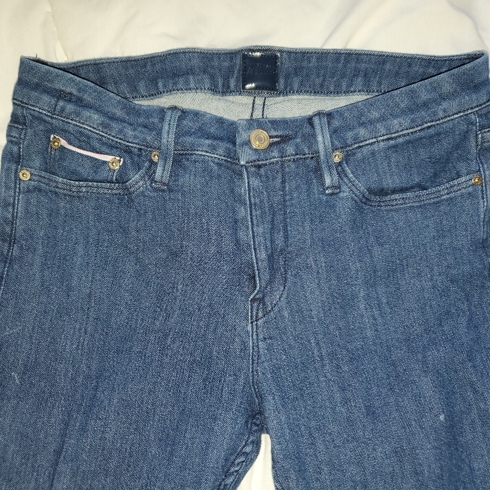 Blue jeans with small pink detailing